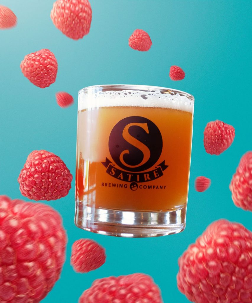 Rhum Raspberry Racoon in glass with raspberries